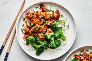 homemade teriyaki chicken served over white rice with steamed broccoli on the side