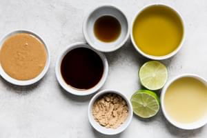 small bowls with ingredients for Thai salad dressing