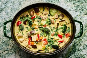 a pot of vegetable curry soup made with onion, celery, carrots, mushrooms, eggplant, broccoli, bell pepper and zucchini