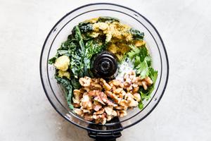 ingredients for walnut kale vegan pesto in a food procesor