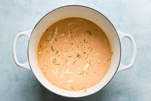 red curry, canned coconut milk, onions and lime in a soup pot