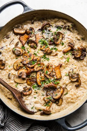 a pot of wild mushroom risotto made with shallots, garlic, thyme, salt and pepper