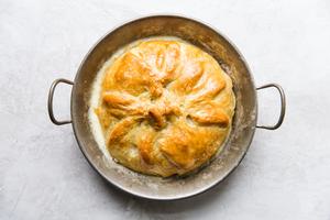 baked brie made with pecans, brown sugar and pepper wrapped in baked puff pastry dough