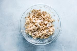 chicken, sour cream, chipotle peppers and cheese mixed in a bowl for chicken quesadilla filling