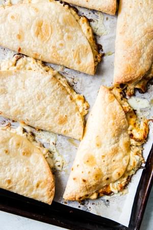 baking sheet of crispy baked chicken quesadillas