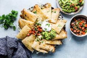 baked chicken quesadillas served with guacamole, sour cream and fresh pico de gallo