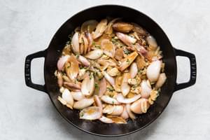Shallots, garlic and thyme sautéed in a cast iron skillet with white wine and mustard sauce.