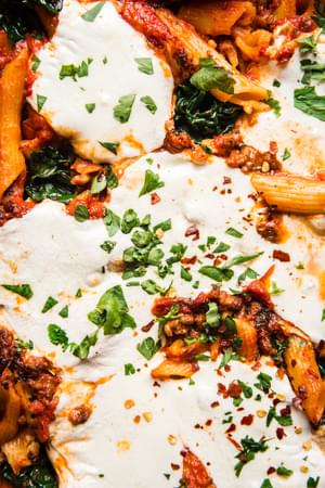 Close up of Baked Penna Alla Vodka With Kale and fresh mozzarella