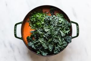 Tomato sauce with cream and parmesan cheese and kale