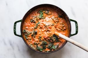 Tomato sauce with cream and parmesan cheese and kale