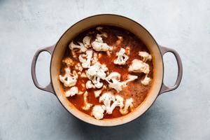 tomato soup with vegetables in a soup pot