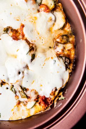 close up of melted fresh mozzarella on top of a veggie lasagna