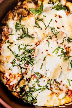 finished vegetarian lasagna with basil and parmesan cheese
