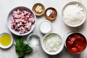 olive oil, onion, pancetta, garlic, vodka, tomatoes, salt, cream, parmesan, red pepper flakes and basil in prep bowls