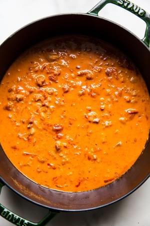 a pot of homemade vodka sauce made with onion, pancetta, vodka garlic, tomatoes, salt, cream and Parmesan