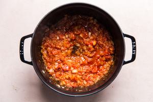 onion and tomatoes sautéed in a pot