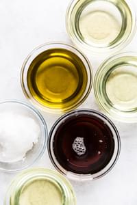 Olive Oil, Canola Oil, Sesame Oil Coconut oil in small bowls