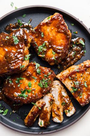4 Hoisin Glazed Pork Chops on a plate one sliced