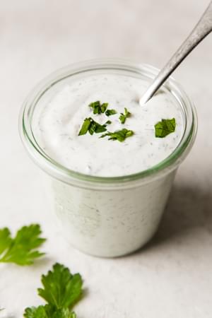 Creamy homemade ranch dressing in a glass jar, ready to elevate any dish with its fresh, herb-infused flavor.