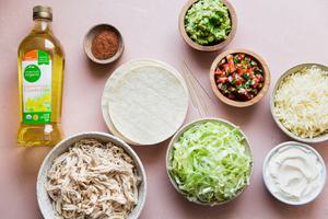 ingredients for Homemade Chicken Taquitos canola oil, taco seasoning, lettuce, corn tortillas sour cream