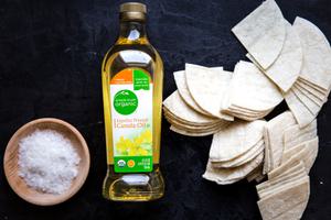 salt, canola oil and raw corn tortillas cut into quarters