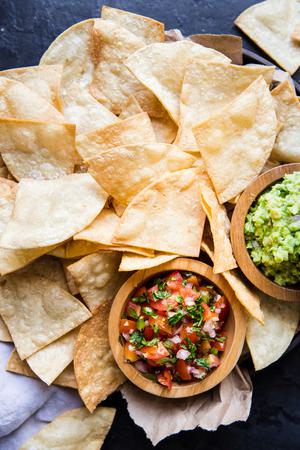 a plate of Homemade Tortilla Chips with salsa and guacamole