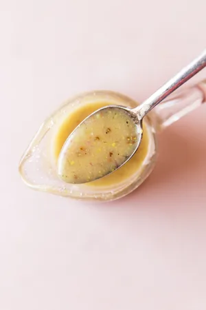 Honey Mustard Salad Dressing on a spoon