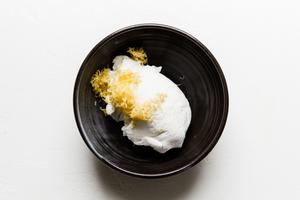 Yogurt, salt and lemon zest in a bowl.