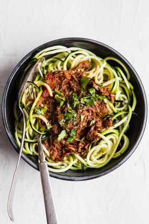 bowl of instant pot ragu over zoodles