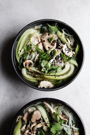 two bowls of Asian inspired turkey soup using leftover turkey