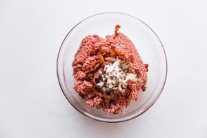 Ground beef, salt, pepper, garlic powder and onion powder in a bowl