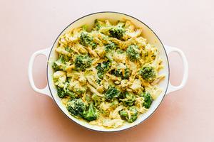 broccoli, shredded chicken, cheddar cheese, chicken divan in a pan
