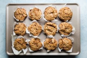 baked zucchini bread muffins in a muffin tin