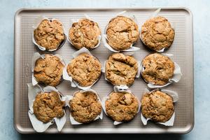 baked zucchini bread muffins in a muffin tin