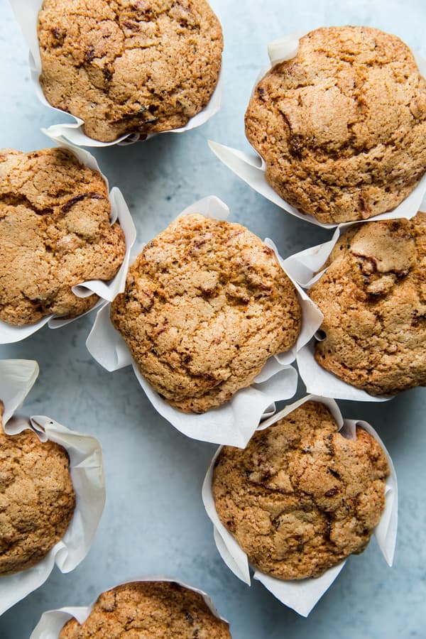 seven zucchini muffins in parchment paper