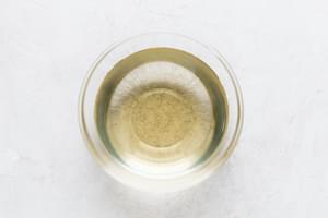 A glass bowl of rice vinegar.
