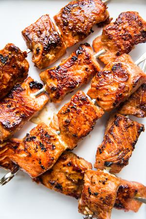 crispy salmon bites on metal skewers