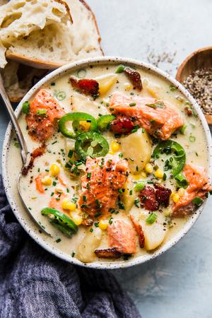salmon chowder with crusty bread in a bowl