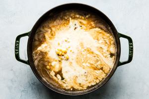 heavy cream added to broth with potatoes and bacon n a large pot