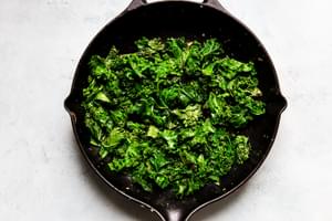 Sautéed kale in a cast iron skillet