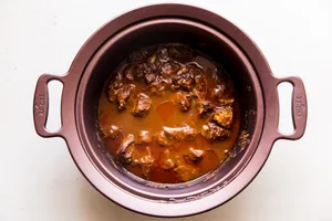 slow cooker butter chicken in a crock pot before being cooked