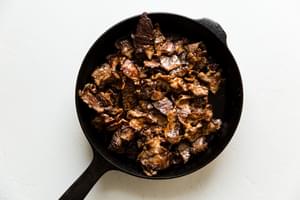 seared steak strips in a skillet