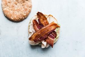 open face sandwich with pesto mayonnaise, turkey and bacon