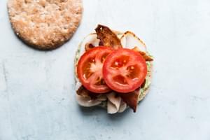 open face sandwich with pesto mayonnaise, turkey and bacon and tomato
