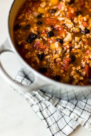 close up of one pot turkey pumpkin chili in a large grey pot