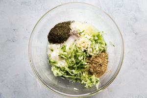 Greek yogurt, cucumber, dill, garlic, lemon juice, salt, pepper & za'atar in a bowl to make tzatziki sauce