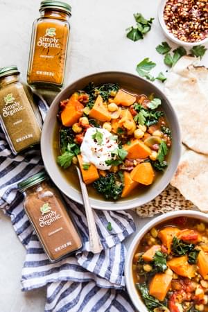 vegetable stew in a bowl with spices cinnamon, turmeric and cumin