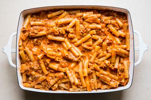 baked ziti in a baking dish with marinara and pasta