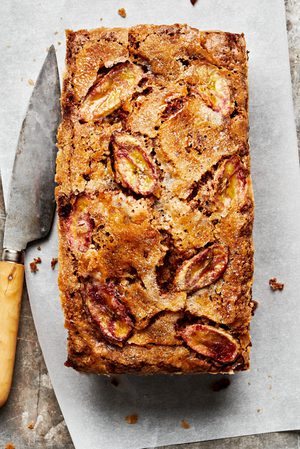 homemade banana bread topped with thinly sliced bananas and sprinkled with sugar in a list of the best baked breakfast ideas