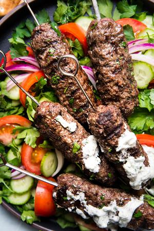Beef Kofta Kababs with Tzatziki pita bread tomatoes on skewers